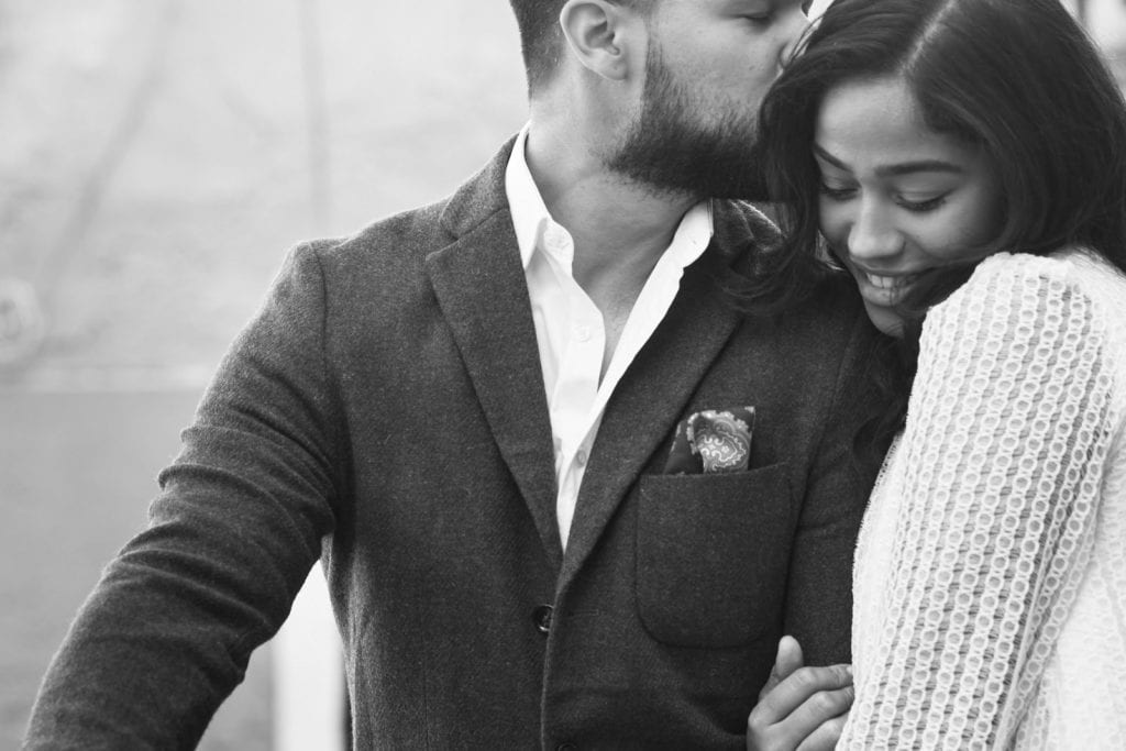 a couple in a romantic pose during their engagement shoot in Lisbon