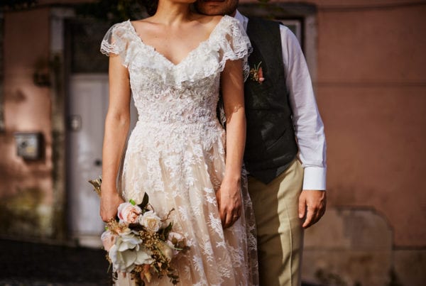 Details of a newlywed couple in their wedding dress in contrasty light, on their elopement in Lisbon