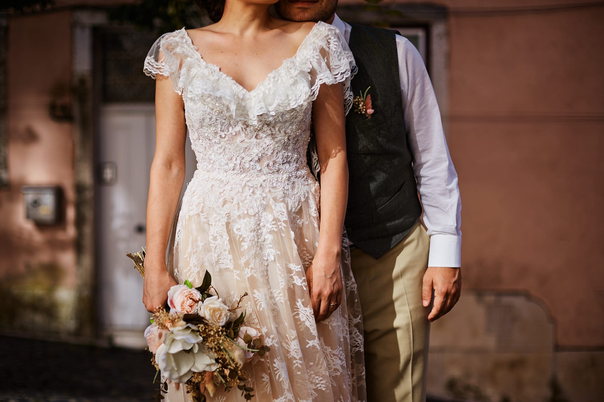 Details of a newlywed couple in their wedding dress in contrasty light, on their elopement in Lisbon